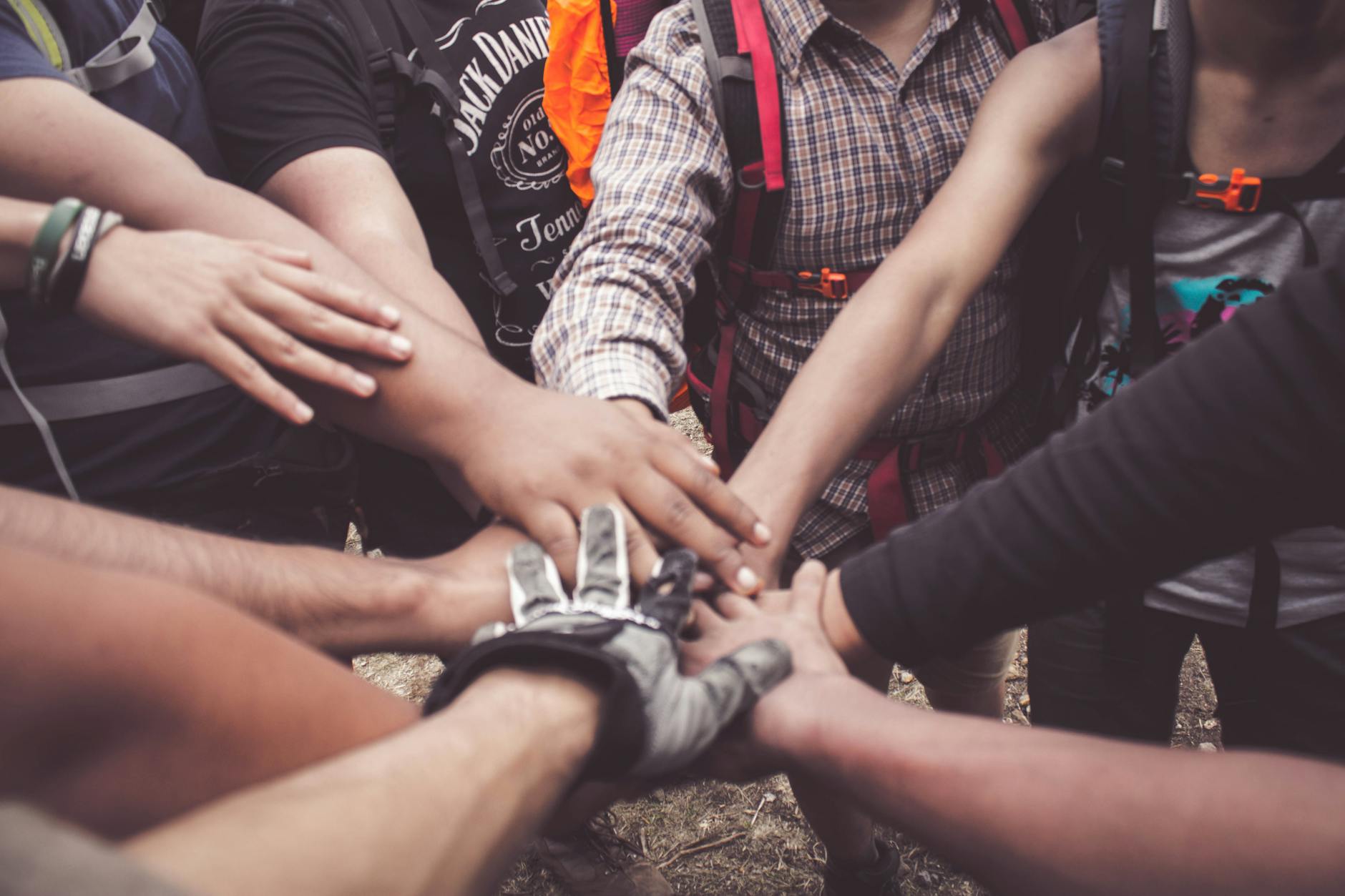 people doing group hand cheer